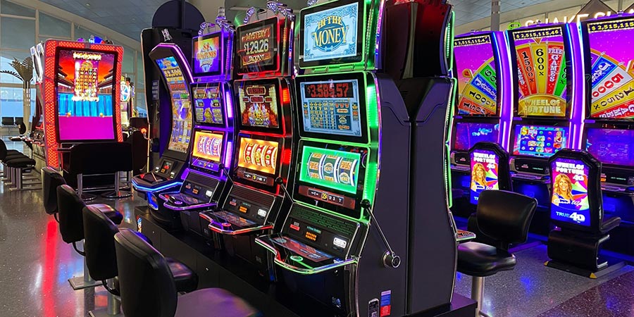 several modern looking slot machines indoors